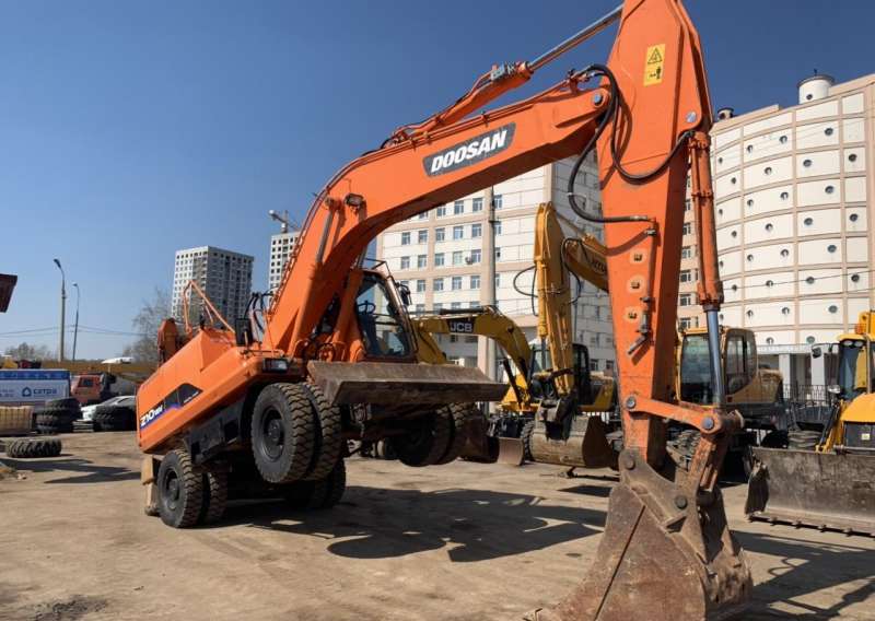 Dx 210. Колесный экскаватор Doosan dx210w. Экскаватор Дусан 210. Doosan s210w-v. Колесный экскаватор DX 210 WA.