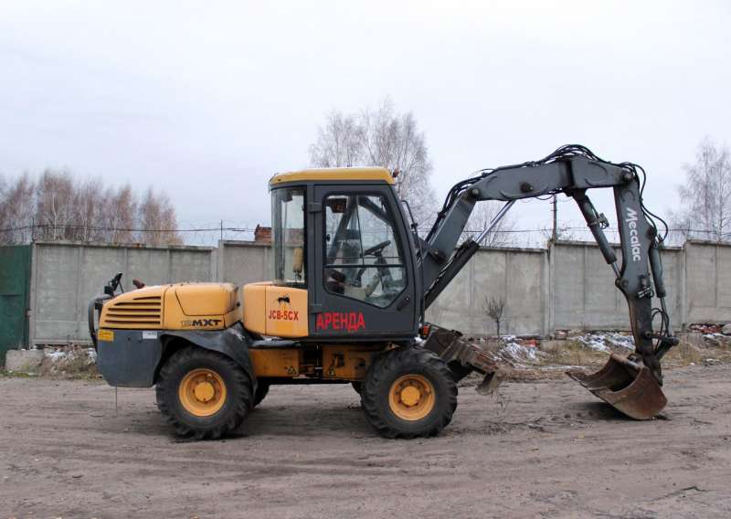 Экскаватор погрузчик Mecalac 12MXT 2003 года