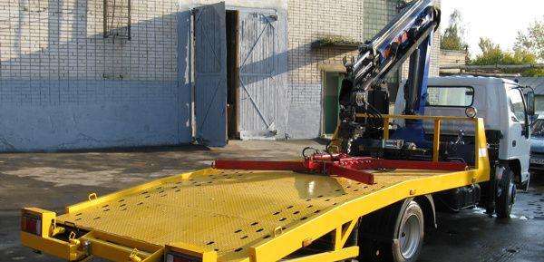 Эвакуатор Исузус ломаной платформой кму PM12012LA