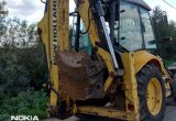 Экскаватор погрузчик NEW holland 110В